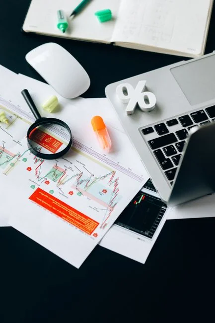 Bright highlighters on a User-Generated Content note against a wooden desk.